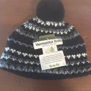 NWT Brand new, never worn Turtle Fur black, gray&white fleece lined pom pom hat